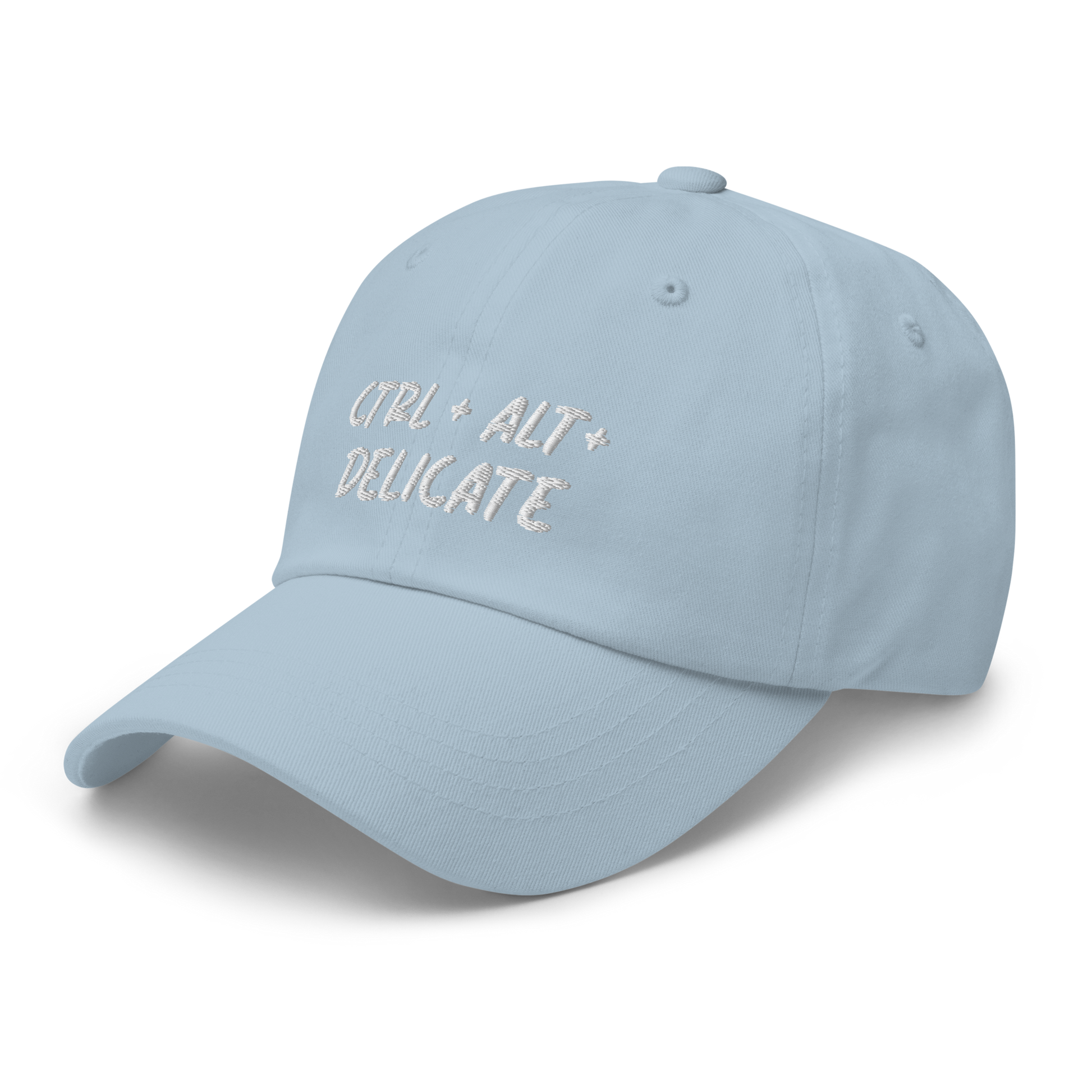 Embroidered dad hat with "Ctrl + Alt + Delicate" design; tech-inspired fashion statement with adjustable strap for a perfect fit, ideal for expressing unique style and humor. Available in Spruce, Khaki, Stone,  Pink, Light Blue