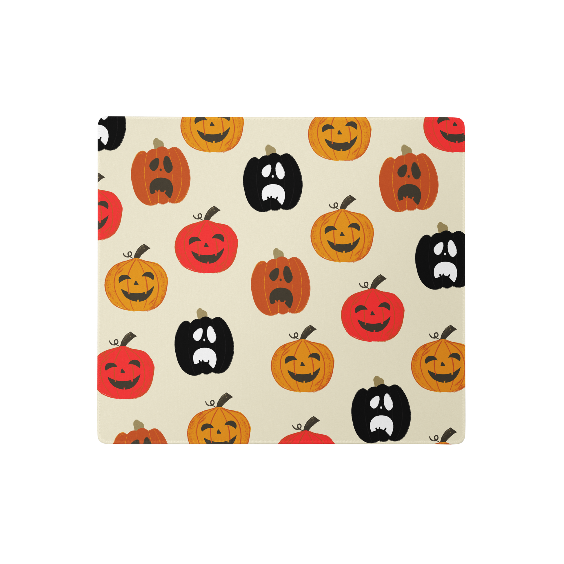 Gaming mouse pad with spooky pumpkin designs; features rounded edges and a sleek, modern look. Made with a 100% polyester top for smooth and accurate movements, adding a haunting touch to any gaming setup.