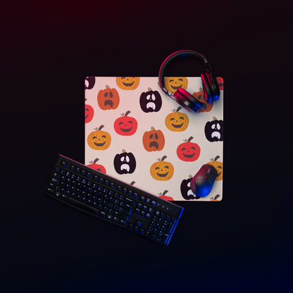  Gaming mouse pad with spooky pumpkin designs; features rounded edges and a sleek, modern look. Made with a 100% polyester top for smooth and accurate movements, adding a haunting touch to any gaming setup.